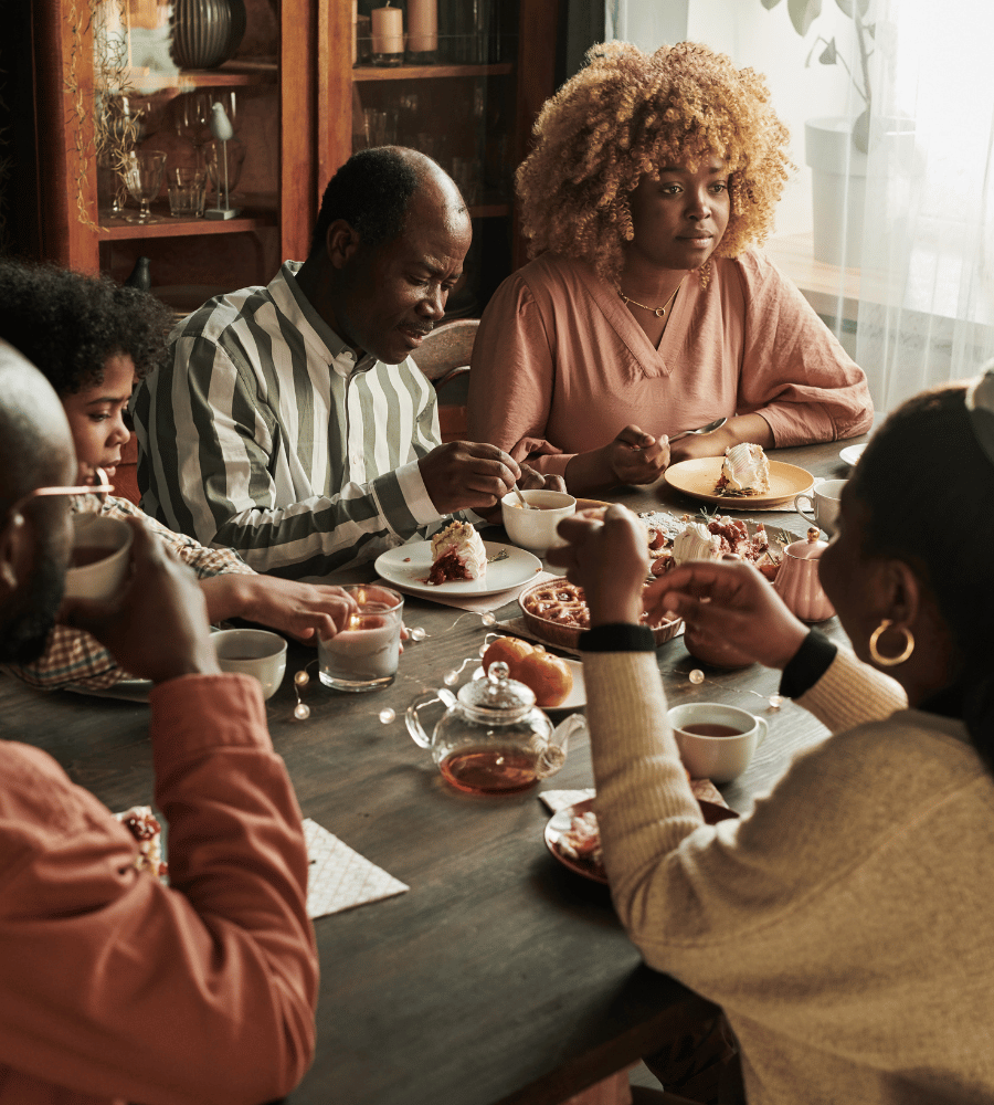 african american family eating dessert and having conversation